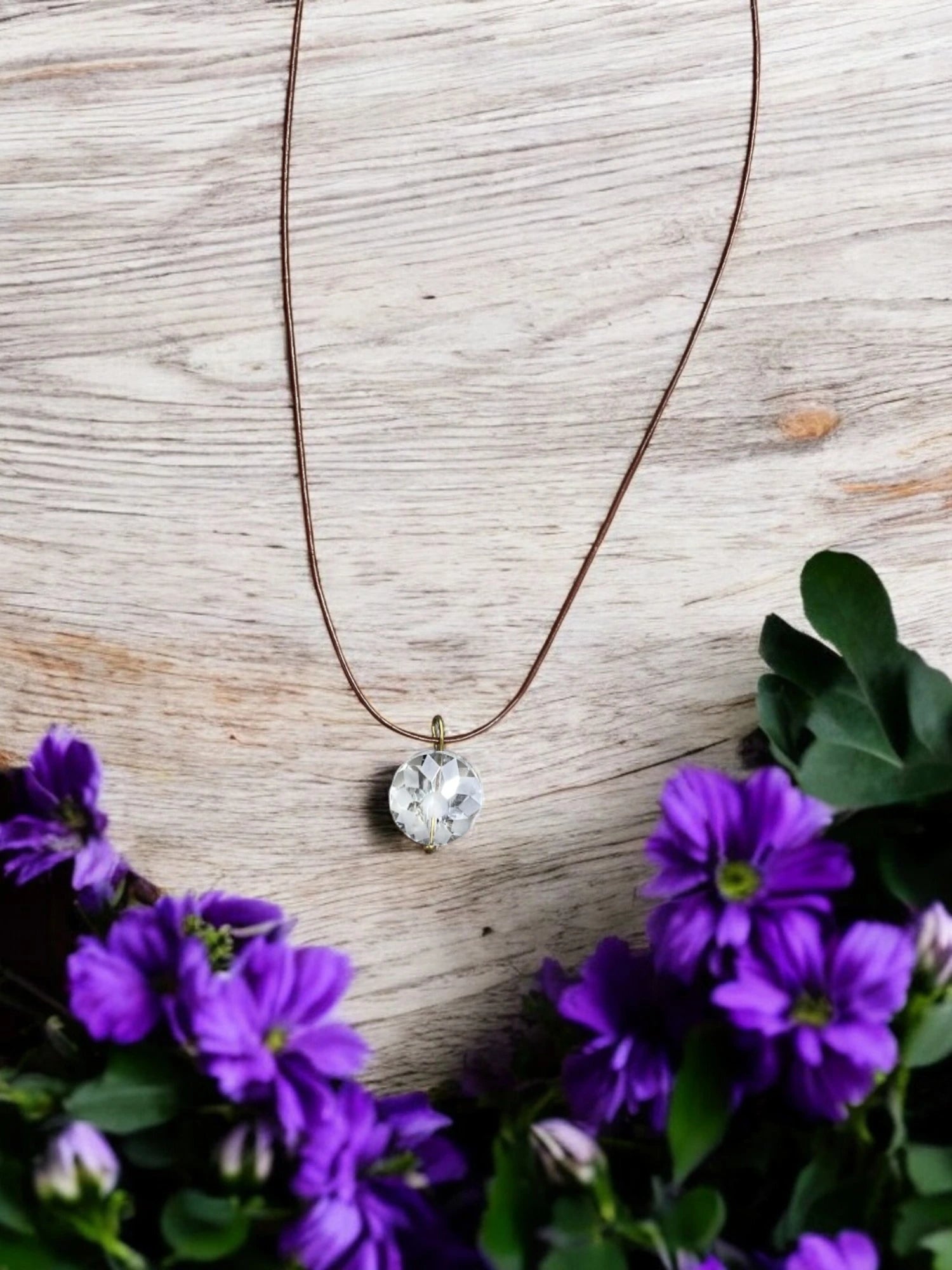 Simple Elegance: Crystal Pendant Necklace on Brown Cord