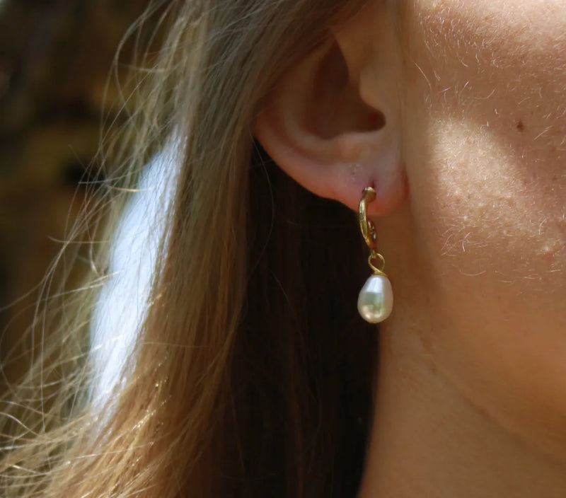 Golden Elegance: Swirling Drop Earrings with Delicate Pearl