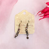 Mesmerizing Swirls: Dangle Earrings in Gold (Green Crystals) or Antique Gold (Pink Crystals)