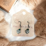 Unleash Your Wild Side: Antique Silver Lion Paw Earrings with Emerald Touch