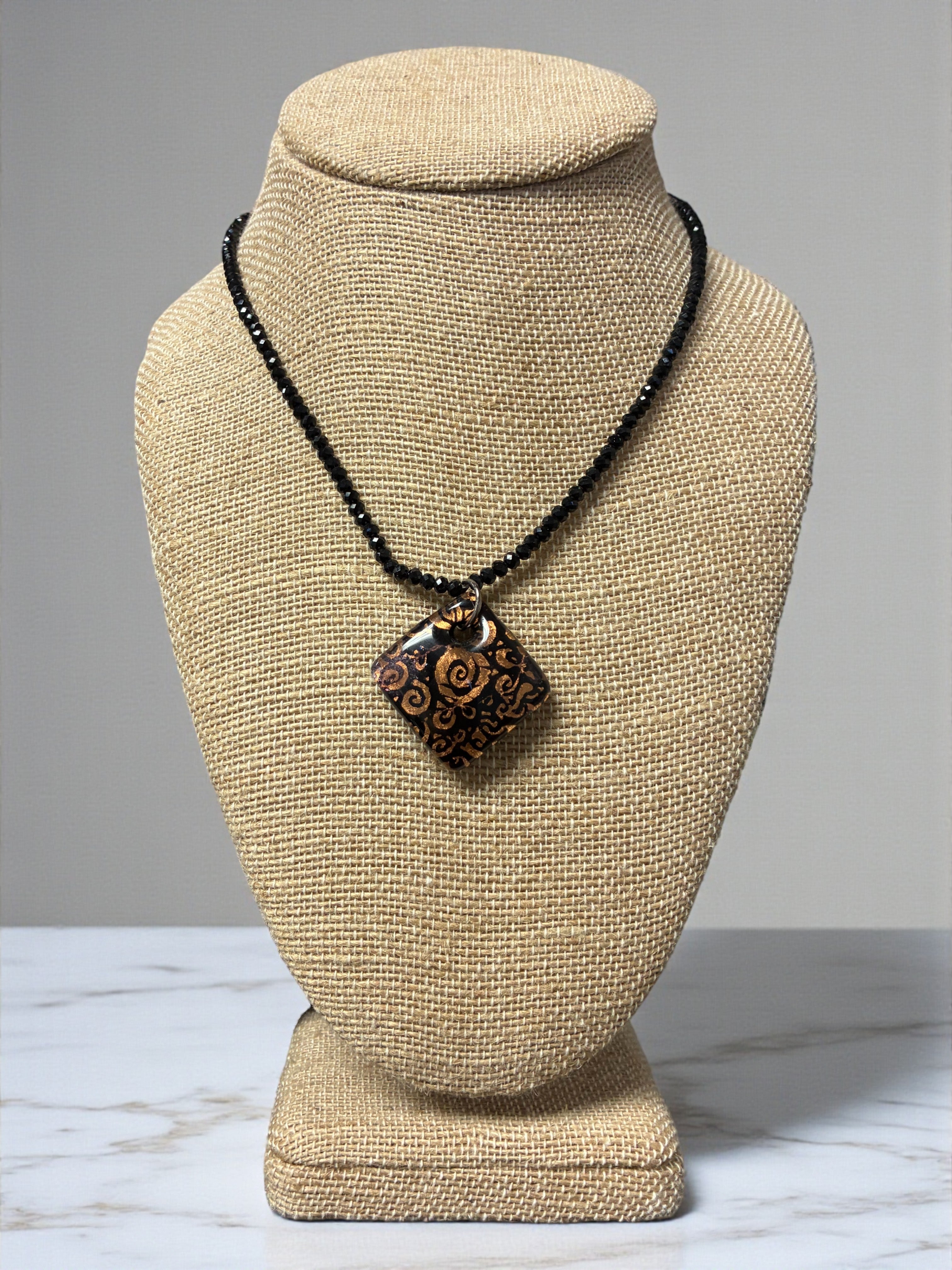 Bold Bronze and Black Swirled Murano Glass Diamond Pendant on Black Crystal Beads