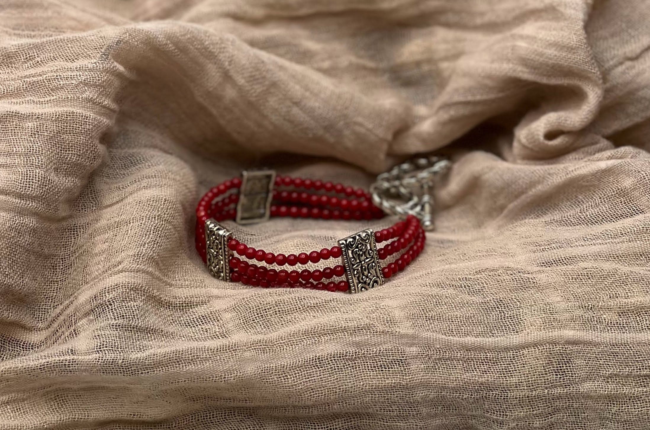 Dazzling Red Jasper Triple Strand Bracelet with Filigree Accents