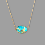 Turquoise pendant on gold chain